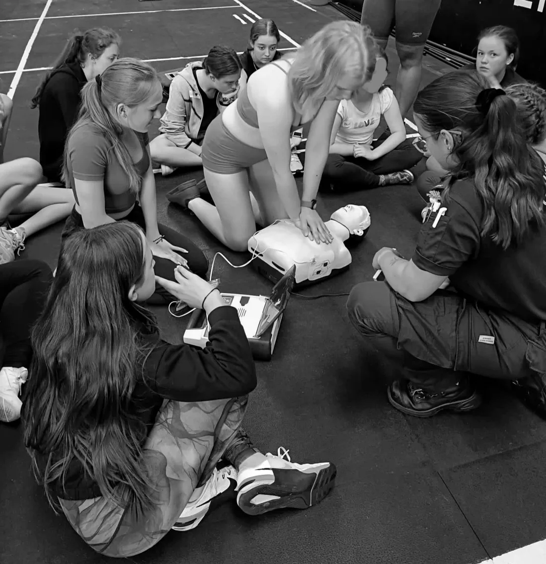 Young people learning first aid and CPR